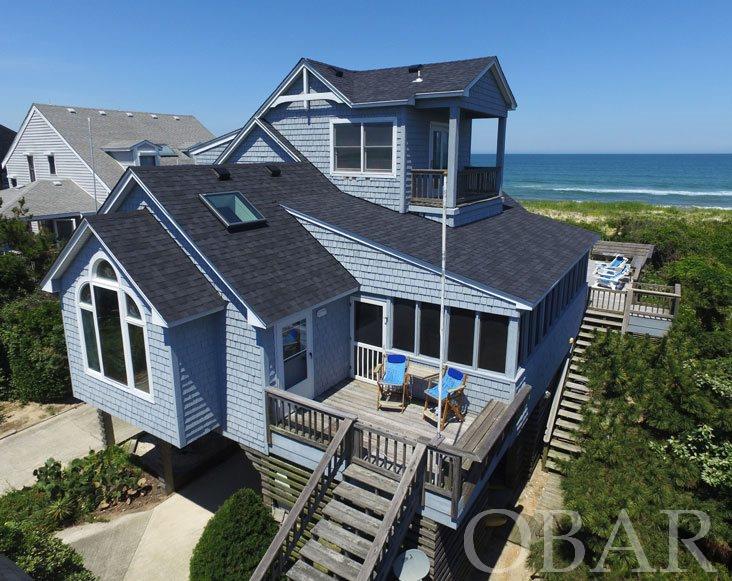 Dreaming about being on the Oceanfront in your own home with views galore? Listening to the sound of the waves and the birds diving for prey? If you imagine yourself inside a photo in Coastal Living magazine, you have just found nirvana!! Oceanfront at its best. Completely renovated in 1992 and lovingly updated and maintained since!  This beautiful home has many attractive features, not the least of which is an updated gourmet kitchen with a palladium window. Adjacent to the kitchen sits a natural wood wet bar with mini frig for ease of entertaining. Another mini for wine sits under a kitchen counter. The living area is professionally furnished with an artistic stone fireplace. The prime focal point, however, remains the expansive ocean views. Friends and family gather on the significantly large screened-in porch which is the envy of the neighborhood. Two spacious bedrooms boast water views and 3 full baths to include the master. But that is not all! A spiral staircase leads to the home’s secret space….a shipswatch large enough for sleeping or for sitting with visitors to enjoy evening cocktails. Decks on three levels provide areas for sitting and enjoying the salty smells, the east to west views and the breezes of the ocean. The main deck is ideal for entertaining large groups…..party on!!!! Another pleasant surprise is a detached, gazebo, perfect for a separate outdoor living space or hot tub!  Convenient outside showers and foot wash available after a day of fun in the surf. Beach access is shared with neighbor to the north, for the reason of limiting dune erosion. Home has a new roof and skylights 2017; fresh interior paint 2017 and new carpeting 2017. Excellent rental history. Sanderling is a highly desirable community. It is quiet and comfortable. Once a bird sanctuary, there are nature paths throughout the entire community. Two soundfront accesses and ramps make boating, kayaking, windsurfing, kite surfing and paddle boarding accessible. Kids will love the crabbing docks. Sunset views are there for daily enjoyment. The amenity complex includes a large pool, a kiddie pool, tennis courts and a state of the art work out facility explicitly for owners and their families. Three highly acclaimed restaurants are within a comfortable walk. Why are you hesitating? You are invited to experience this lovely home today! Check out the Virtual Tour!