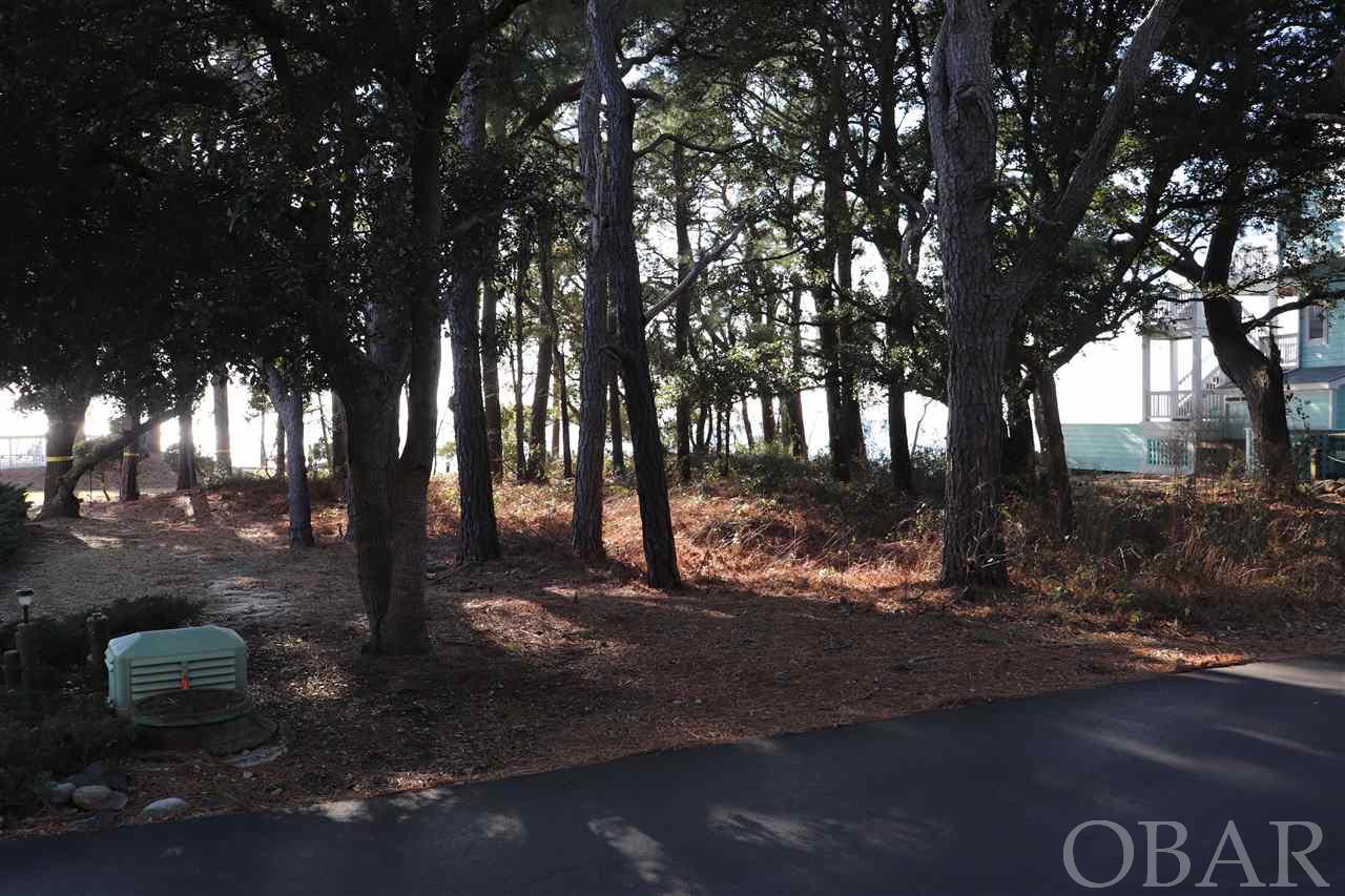 This is a rare opportunity to own a true sound front lot in the Monteray Shores Community.  No marsh!  Unobstructed sunsets over the sound views are just one of the many reasons to build your dream home here. This high lot is already bulk-headed and should require very little site work to accommodate your new home.  To make it even easier, a survey and home site plan (for a 6 bedroom home with a pool!), were completed in August 2020 and are available in the associated documents.    This gorgeous community boasts amenities that include a pier with gazebo, picnic area, playground, a clubhouse, exercise facility, basketball and tennis courts.  The outdoor pool area includes a large pool + kiddie pool with restrooms and outdoor showers. The sound front boat ramp makes kayaking, canoeing and boating a breeze!