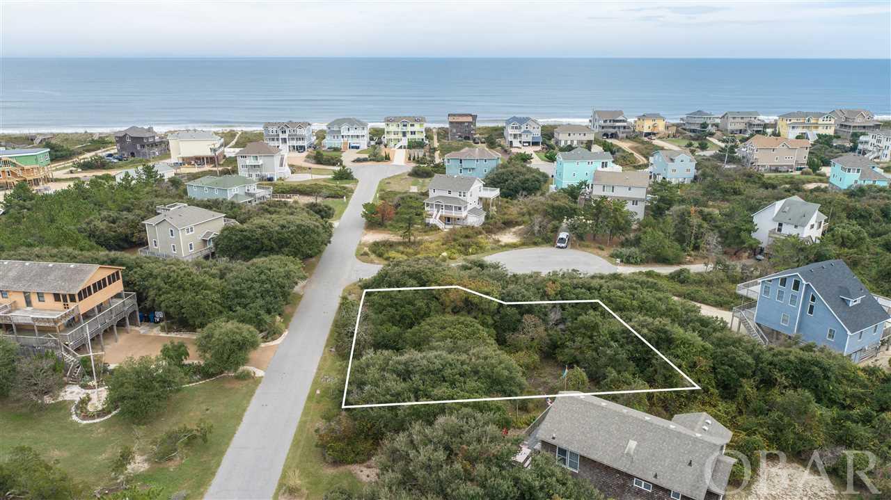 Awesome lot just 3 lots to the oceanfront in this ocean to sound community in Duck.  15,486 sqft. lot with straight shot to the beach.  Caffey's Inlet Hamlet offers beach access, and soundfront area with dock, grills, and gazebo.  Enjoy the sunsets in the evening and sunrise in the morning.  Fantastic opportunity to buy a lot and build your dream vacation home with one of the best custom home builders on the beach.  Sale of lot is subject to a signed building contract with builder/owner.   Use a builder plan or design your home from the ground up.