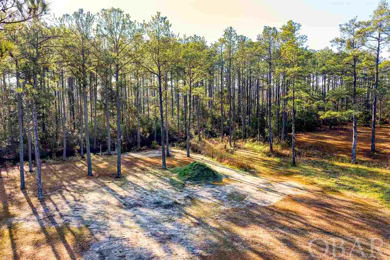 This is your opportunity to own a canal front home-site close to the heart of Manteo on Roanoke Island. Just minutes to the beaches of the Outer Banks but tucked away on a quiet cul-de-sac. Don't wait, call today!