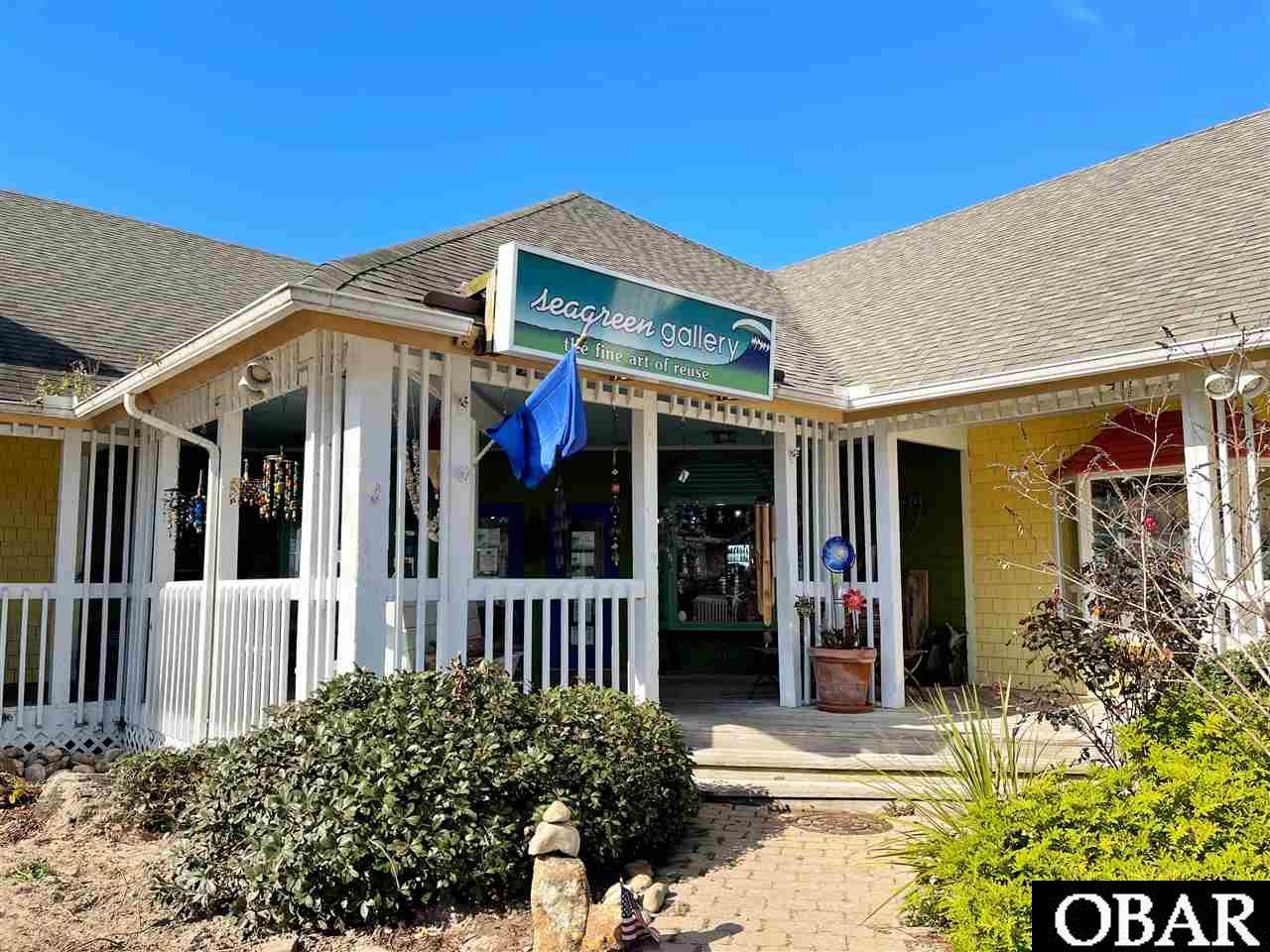 Rare opportunity for commercial condo on the sound side of Duck with lots of foot traffic and direct boardwalk access. Condo currently has tenant/ business with lease. Unit has 1,822 sq ft of retail space with an additional 939 sq ft of unheated/unfinished storage space upstairs. *NOTE all measurements were taken from inside of the building.