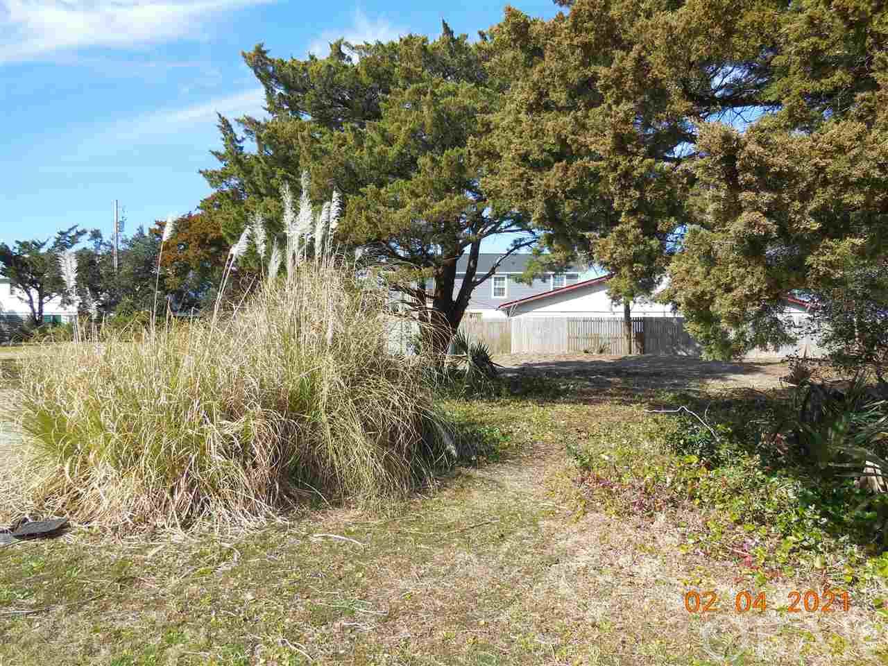 A 5117 sq. ft. lot in Live Oak Village, a new 7 lot subdivision in the heart of Ocracoke Village. Conveniently located and within walking distance to all village activities. Conveys with a 4 bedroom septic permit and a 3 bedroom/2 bath water meter. Restrictive Covenants in place to maintain the historic charm and quaintness of Ocracoke Village. Many house designs to choose from! Start calling Ocracoke home! Taxes are an estimate only. Currently being taxed as one large parcel.