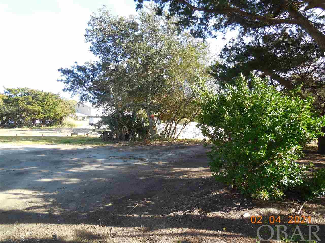 Be a part of the new 7 lot Live Oak Village subdivision! This 5000 sq. ft. property has a great location for a primary year-round residence or a vacation rental home. Lot# 11 R conveys with a 4 bedroom septic permit and a 3 bedroom/2 bath water meter. Restrictive covenants in place to retain the historic charm and quaintness of Ocracoke. Choose from several classic coastal home designs! Taxes are an estimate only. Currently being taxed as one large parcel.