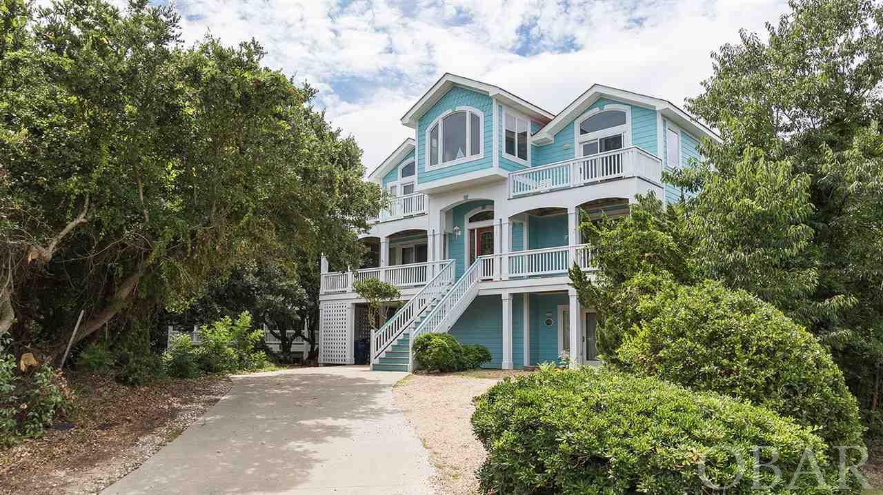 This fantastic investment property was built for FUN in the SUN! Seas the Beach consistently books more than 25 weeks a year with over $100,000 in gross revenues - and it’s easy to see why!  This beach house is pure fun and the guests keep coming back!  Great poolside action plus direct (shaded) sidewalk access to the beach - it’s only a 3-minute walk from the backyard! Guests flock to the multi-level south-facing decks with access to the luxurious poolside entertaining area.  This home is a vacation destination with everyone’s most-wanted outdoor amenities - a heated pool, hot tub and showers, fire pit, volleyball, and cornhole.  The pool-side cabana is the focal point for outdoor fun and is a popular spot for grown-ups to relax and catch up with friends and family. A ground floor game room and kitchenette provide a convenient indoor/outdoor connection to poolside fun. Indoors, the beautiful third floor great room is graciously appointed and provides plenty of room to spread out with the whole family.  A reading nook/office space offers a quiet spot to take a break from vacation.  Guests who prefer the cooler weather of the OBX shoulder seasons are thrilled by the appeal of the indoor/outdoor fireplace, the hot tub, and the cozy firepit - perfect for relaxing with a glass of wine.  Pickup the stuff to make s’mores! See the associated documents for many of the upgrades and rental figures that make this home ready for business and pleasure! Copy/paste into a new browser window the video link of the property showing its proximity to the Atlantic and all that the Village of Duck has to offer: https://youtu.be/6OywBwyCarU