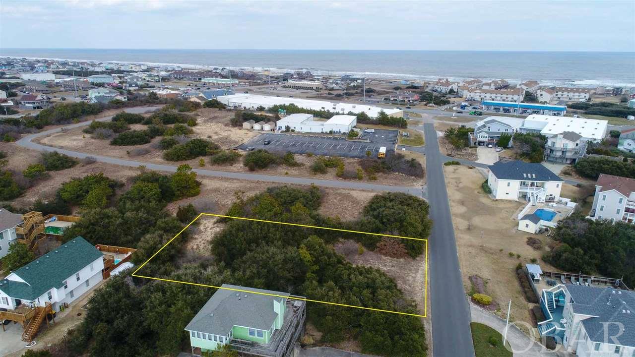 Perched high between the ocean and sound is the perfect spot to build the home of your dreams. This is one of the HIGHEST lots in Kitty Hawk with nearly 40 feet of elevation. Potential Ocean Views and its Central location make this an ideal homesite. Close to several restaurants and shops, as well as, Kitty Hawk's Multi Use path along the sound. Don't miss out on this high and dry property!