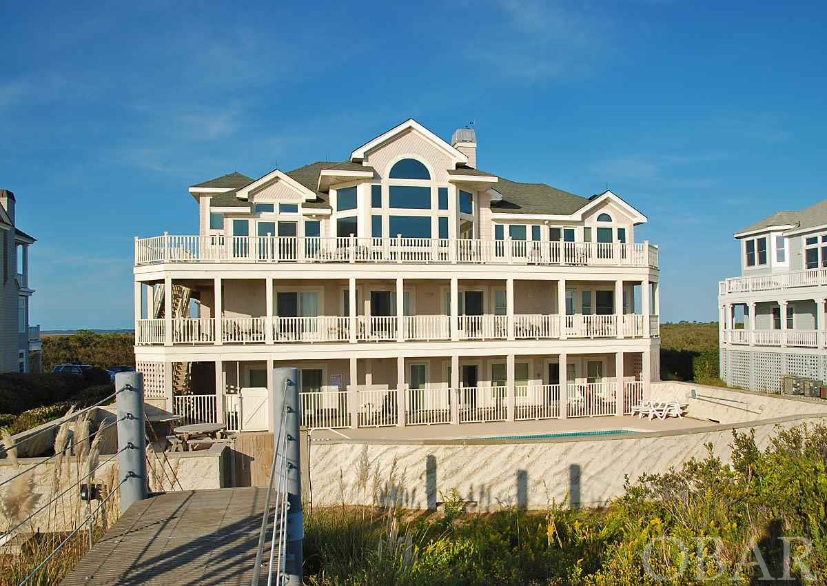 A RARE OPPORTUNITY on BEAUTIFUL HICKS BAY LANE! Nestled between the shores of the Atlantic and the pristine serenity of the Audubon Sanctuary in Pine Island, we present a grand oceanfront home, CARPE BEACHUM. Enjoy spectacular ocean to sound views and beautiful sunrises and sunsets from spacious decks on two levels. Extensive renovations in 2012 combined with thoughtful and strategic upgrades throughout the property since 2014 in partnership with top drawer designers and builders, there is no stone left unturned in making this home a memorable destination for family and friends. In total, capital improvements exceed $258,000 including decks, exterior paint, windows, flooring, appliances, electronics, and HVAC system components. A detailed breakdown is available upon request for a preapproved and discerning buyer. A grand home, the top-level features an open and airy floor plan including a spacious great room, dining room, a well-appointed kitchen with high-end appliances, and a large en suite bedroom complete with fireplace, private oceanfront deck, and luxurious bath. The mid-level features spacious bedrooms and a covered deck overlooking the ocean and pool. The lower level offers two more en suite bedrooms and a lovely poolside game room and kitchenette. Just around the corner is a theater outfitted with a beverage center and seating for 15. Now is the time to INVEST in this beautiful Pine Island jewel box with rentals in 2021 north of $291,000! ENJOY the wide sandy beaches and the scenic vistas. RELAX with the vision and the knowledge that this could be your dream come true after waiting for just the right moment in time for such a wonderful home to come along.