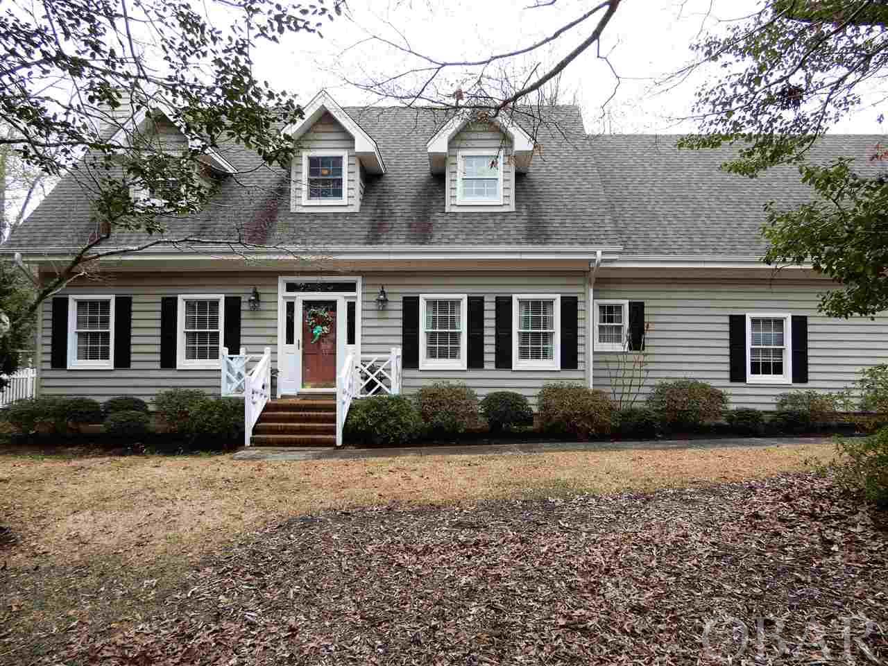 Must see this custom-built 4BR 3.5 BA home located on the northern end of Roanoke Island within the Brakewood community.  This warm, inviting Cape Cod home is filled with natural lighting featuring an open floor plan, spacious kitchen, gas fireplace, screened porch, outdoor deck, master ensuite with jetted tub, office workspace, bonus room, a large in-ground pool and more!  Making your favorite meals is a breeze with plenty of counter space.  This spacious kitchen is the perfect balance of elegance and functionality with granite counters, stainless appliances, a center island for sitting and adjacent pantry and laundry room.  The kitchen opens into the dining area make for perfect gathering spot for family or guests.  A home office space beautifully situated and equally convenient.  A built-in desk  with custom cabinetry and shelves will help you keep things tidy and in order.  You can unwind in the living room where the gas fireplace keeps you warm and cozy.  Looking for a soothing outdoor retreat?  The screened porch is the perfect way to extend your outdoor time throughout the seasons.  Sip on a cool glass of sweet tea while enjoying the peaceful sights and sounds of nature or to share a meal in the fresh air with your family and friends.  Summer, sun and swimming enjoyment.  The beautiful 9’ deep in-ground pool is a wonderful way to cool off during the hot summer months.  Plenty of space to entertain or relax while enjoying privacy in the fenced in backyard space.  The ensuite master bathroom is complete with walk in closet, built in vanity, jetted tub and walk-in shower provides an oasis of peace and safe haven after a long day.   Finished room above the garage provides extra space that is always welcomed! Whether you use it as a guest bedroom, playroom or office, it’s a bonus room with flexibility.  The garage has plenty of room for two vehicles plus shelfing for storing outdoor hobby gear or seasonal decor.  If the power goes out, you don’t need to worry - just connect the portable generator to have power during the outage.  Updates throughout the home include granite countertops, backyard fencing, roof gutters, tankless water heater, gas fireplace with remote control, additional wireless hotspots, and additional attic insulation. Newer roof and pool liner plus cover.  Installed town water meter with water lines to the house.  Furnishings are not included.  Great opportunity for first time home buyer, retiring couple or family looking for a quiet residential community near Historic Manteo, schools, shopping, restaurants and attractions.  Please use Covid protocol - wear a mask and use hand sanitizer during showings.
