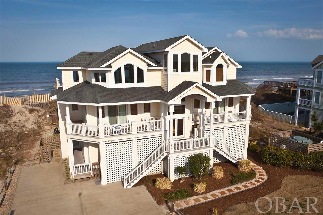 Sensational ocean views, luxurious comfort, vast entertainment spaces, 10 inviting bedroom suites (8 en suites) and fun outdoor amenities.  A prime oceanfront location, 4 King en suite bedrooms with ocean views, distinctive upgrades and fine furnishings create a MacDaddy waterfront estate for Outer Banks vacations. HVAC1 2020, HVAC2 2020, HVAC3 2021, exterior paint 2020, new hot water heater 2018, and all new smart tvs! The Whalehead community is known for its large home sites and wide, pristine shoreline. Nearby access to shopping, fine dining, casual eateries, historical venues like the Currituck Lighthouse and vast recreational opportunities.  The rental income is off the chain~