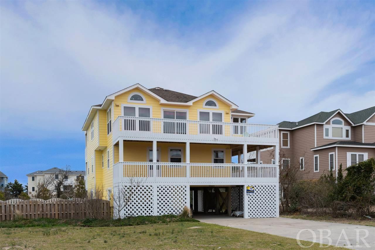 "Heaven Sent" is an awesome 3rd row location in Whalehead with ocean views! And, close to the beach access, too! The exterior's just been freshly painted and ready for a new owner.  You'll love the layout of this 6 bedroom - 5 bath home in Whalehead. The large concrete pool area is going to be the place to hang out when you're not at the beach. Pop into the hot tub or enjoy the game room activities/wet bar on the ground level. There's a bedroom and full bath here as well as a full laundry. On the mid-level you'll find 4 bedrooms. Two of them are masters with access to the decks and two other bedrooms with a shared bath. The top floor is large enough for everyone to gather around the kitchen table or watch your favorite sport/movie. There's a master and half bath on this level and a great screened porch for dining. And, when you want a better ocean view head on up to the exterior stair tower for a primo lookout you can enjoy any time you like! Hurry, this one has your name on it!
