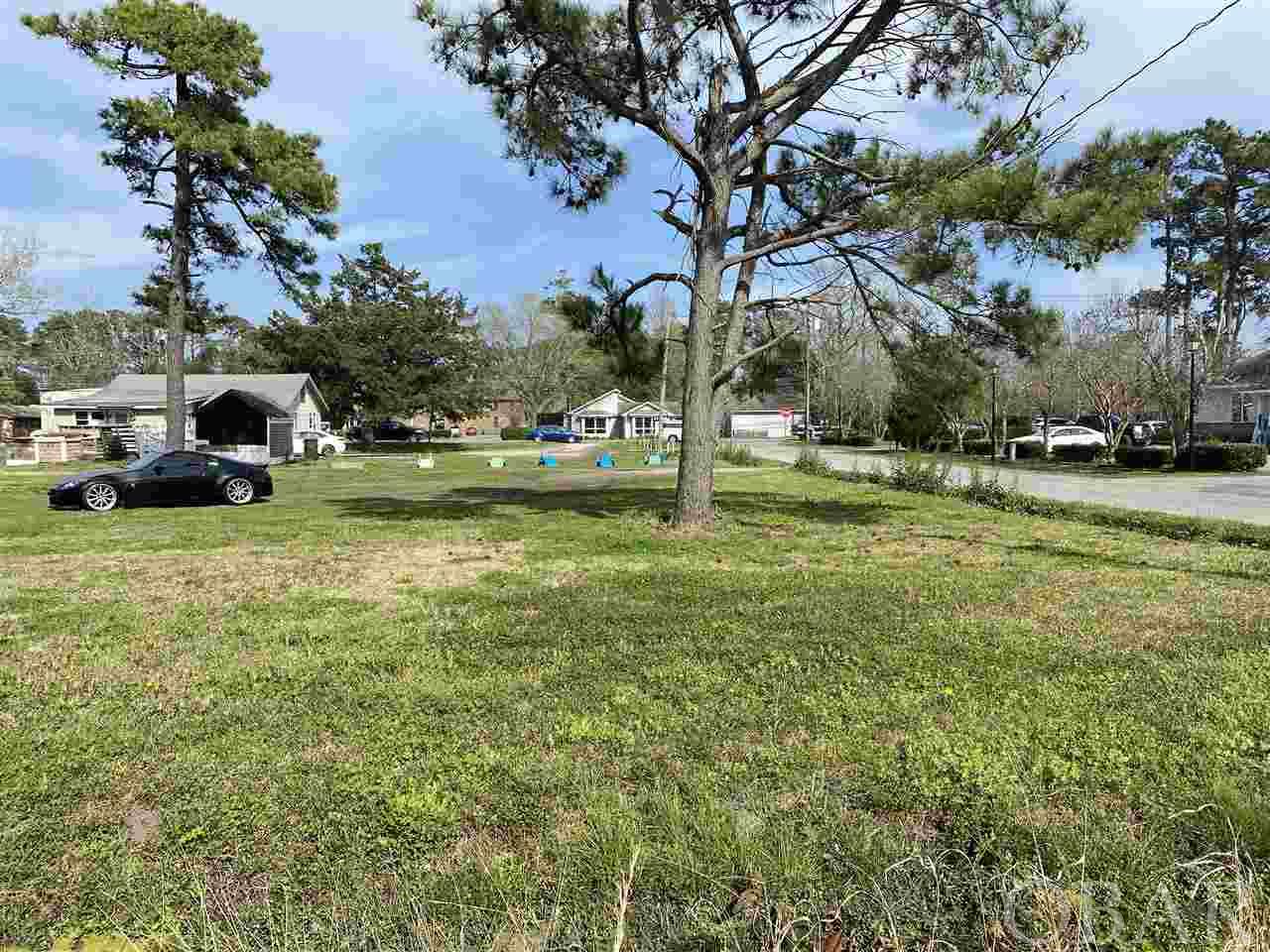 Large corner lot in Manteo, located close to schools and downtown Manteo.  This lot is zoned commercial / residential.  Make an offer!!!