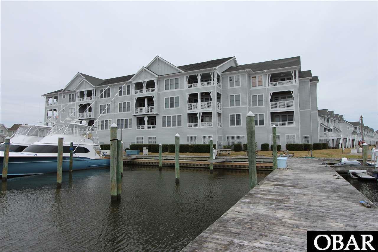 Beautiful top floor condo in Gulfstream Villas.  ELEVATOR building.  Assigned Parking.  Designed with an open floor plan, this three bedroom three full bath condo overlooks the Pirates Cove Yacht Club and Marina. Steps away to MIMI Tiki Bar and Bluewater Bar and Grill.  Pirates Cove Amenities include 2 pools, clubhouse, lighted tennis cts, playground, volleyball ct., fitness center and miles of lighted docks.  Sold Furnished, turnkey.
