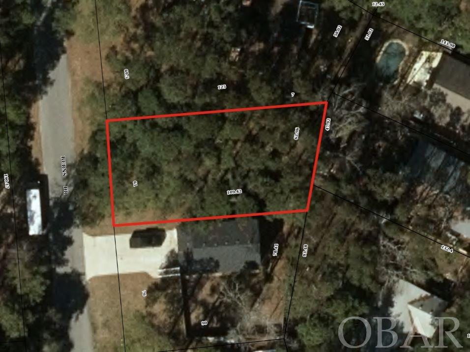 Building lot in Ocean Acres. Water Tap Fee has not been paid. KDH water dept (252-480-4080) can give costs on water tap fee plus charges to connect to municipal sewage system-