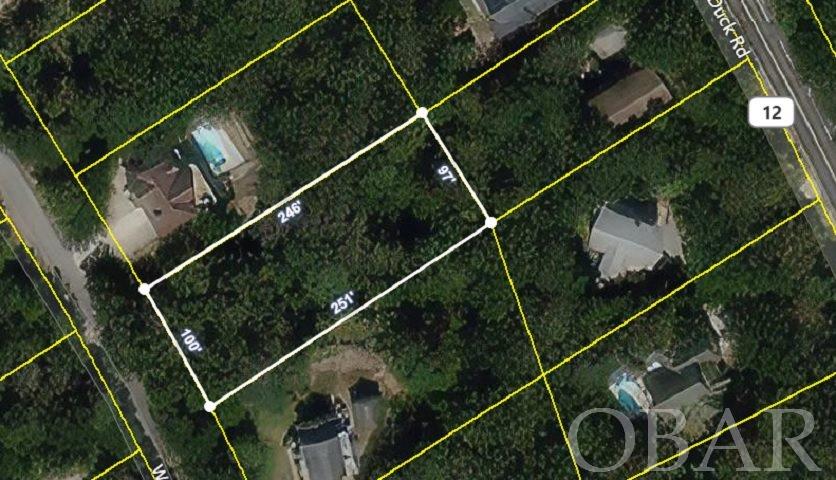 25,000 square foot building lot in the heart of Southern Shores.  Close to the beach, bike path, shopping, and dining.  This would make a great spot for a year round residence, a vacation rental, or a second home retreat.  Large lot will accommodate a substantial house and a pool.