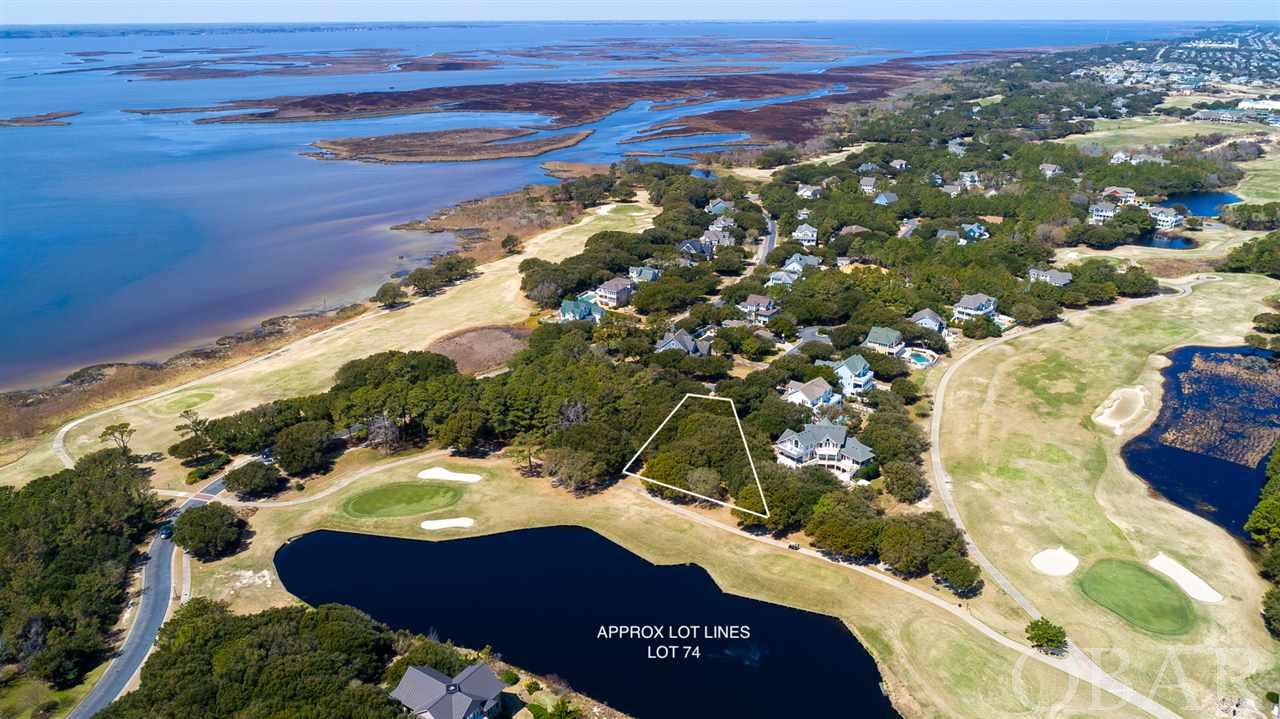 On the 6th hole with possible sound views as well. This pristine lot is awaiting your dream home to be built in the prestigious gated community of The Currituck Club. Potential sound views depending on the build, and the back of the lot boasts water and golf course views to the south. Enjoy all the amenities that the Currituck Club has to offer including private beach access with valet trolley service available, a Rees Jones designed 18 hole golf course with driving range, pro shop, and Bistro. Multiple community pools, tennis courts, and a fitness and heath center make this community ideal for full time ownership or provide great options for a guests looking for an idyllic rental. Well appointed and  located minutes away from shopping and dining in Corolla. The historical Whalehead Park, Corolla Lighthouse, and the 4-wheel drive beaches are just minutes away!