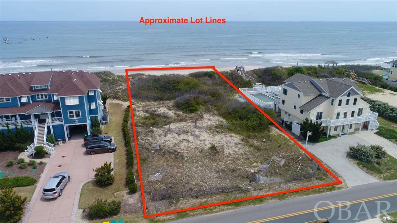 Premier Oceanfront lot in Corolla!  There only a few oceanfront lots left in all of Corolla.   This is your opportunity to own an incredible piece of waterfront in the subdivision of Whalehead.  High elevation, a large vegetated dune and a wide sandy beach provides the perfect place to build your dream home.  Survey on file shows lot square footage as 37,500.  Ground elevation mark on survey indicates 18.4 feet!   Go walk the lot for yourself and see the difference.  A great opportunity!