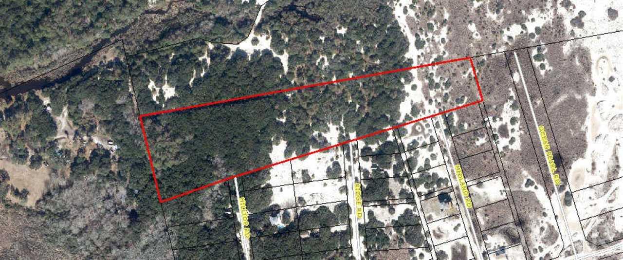 Incredible 8 acre parcel border the USF&W/Currituck Wildlife Refuge land.  Beautiful maritime forest setting with live oak groves and abundant privacy.  Potentially subdividable  For those wanting extreme privacy yet still feel the Ocean breezes this is your place!  Wildlife abounds and there are several high elevated ridge areas perfect for a home site.  Additional land also available