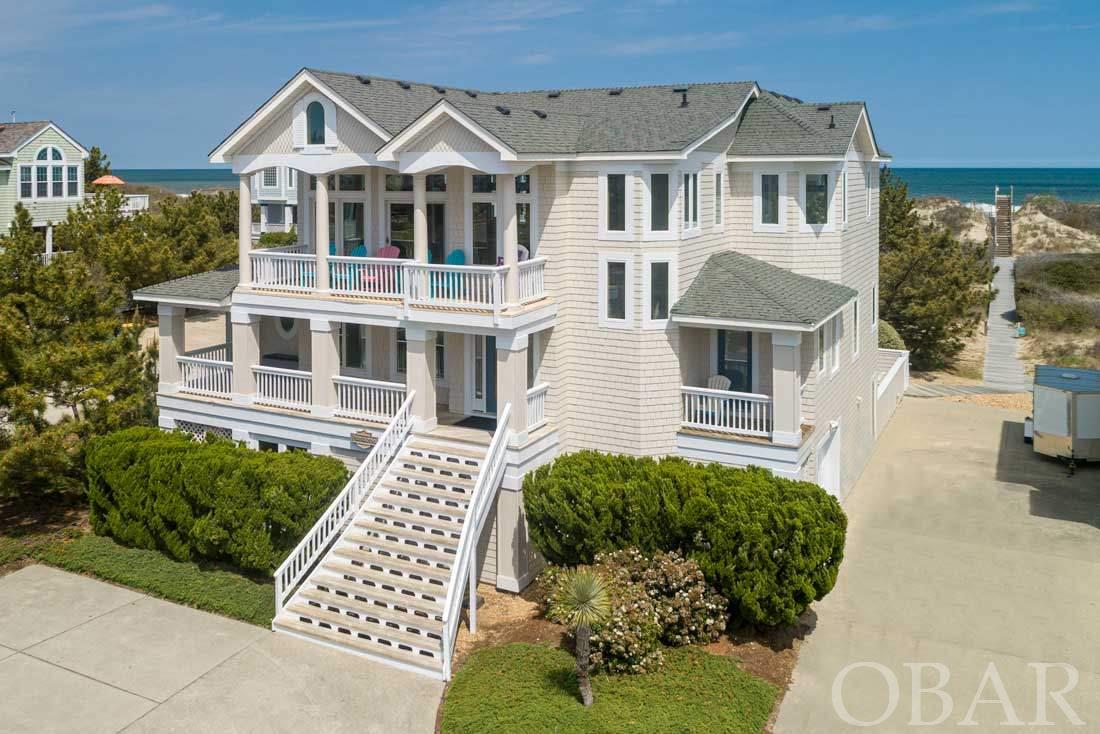 Great 2nd Tier Oceanfront in prestigious Buck Island. Outstanding views and a semi private walkway. This home has been a solid rental for years, but has many weeks that could be booked. ( Owners take off the market ) The top level offers a huge great room, hardwood floors and vast windows for excellent views of the ocean.  This level also offers a gourmet kitchen with granite counter tops and dual dishwashers. The kitchen and breakfast area also share the view.  A large dining area rounds out this level.  There is also an additional wet bar with a built in wine cooler. All bedrooms in the house are generously sized.  The mid level has 3 large bedrooms which are all are masters. Two are King bedrooms, with deck access. Both include a jetted tub in the bathrooms. The 3rd master is a Queen. This level also has an open office area with direct deck access. The ground level features 3 bedrooms that share 2 baths. There is a semi-private King bedroom and 2 other bedrooms; one with a set of twins and another with 2 bunk sets. There also is a good size den with a kitchenette that includes a sink, refrigerator and microwave.  Panacea offers a huge, gunnite private pool and hot tub and gas fireplace. The exterior was painted in April 2021!   The HOA protects community aesthetics with the paint fund (included in the total we give in financial section) for the exterior of the houses.  Don't forget the excellent Buck Island amenities, which include an Olympic size pool, tennis courts, playground, plus a bath house and walkway to the beach. This gated and beautifully landscaped area is walking distance to  restaurants and shops!