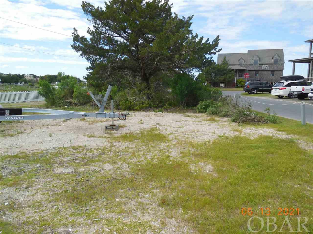 A 6600 sq. ft. lot located on Creek Road across the street from Silver Lake! An installed 4 bedroom septic system and 3 bedroom/2 bath water meter convey with the sale. With the new height restrictions on Ocracoke, a reversed plan home built on this property, has the potential for Pamlico Sound, the Ocracoke Lighthouse and Silver Lake views. Beautiful sunsets! Charming island setting. Cleared and ready to build!.
