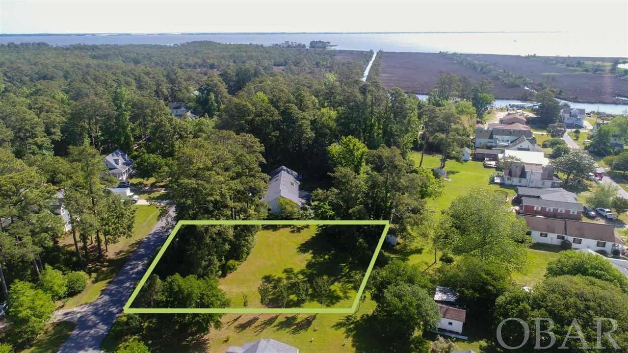 A Roanoke Island gem! This spacious 17,000+/- SF lot is located in the highly desirable, well established Wescott Estates subdivision and ready for your new build. Within walking distance of downtown Manteo, schools, parks, restaurants and shopping, Creekview Lane provides exceptional convenience with peaceful serenity. Large shade trees along the front and rear of the lot create natural privacy, with large clearing directly in the middle. The lot is flat with ~120 feet of road frontage, making this an exceptional canvas for your new construction project. Public water available and no HOA! Ideal location for primary, secondary, or incoming producing vacation rental home. Schedule an appointment to view today. This one won't last long.