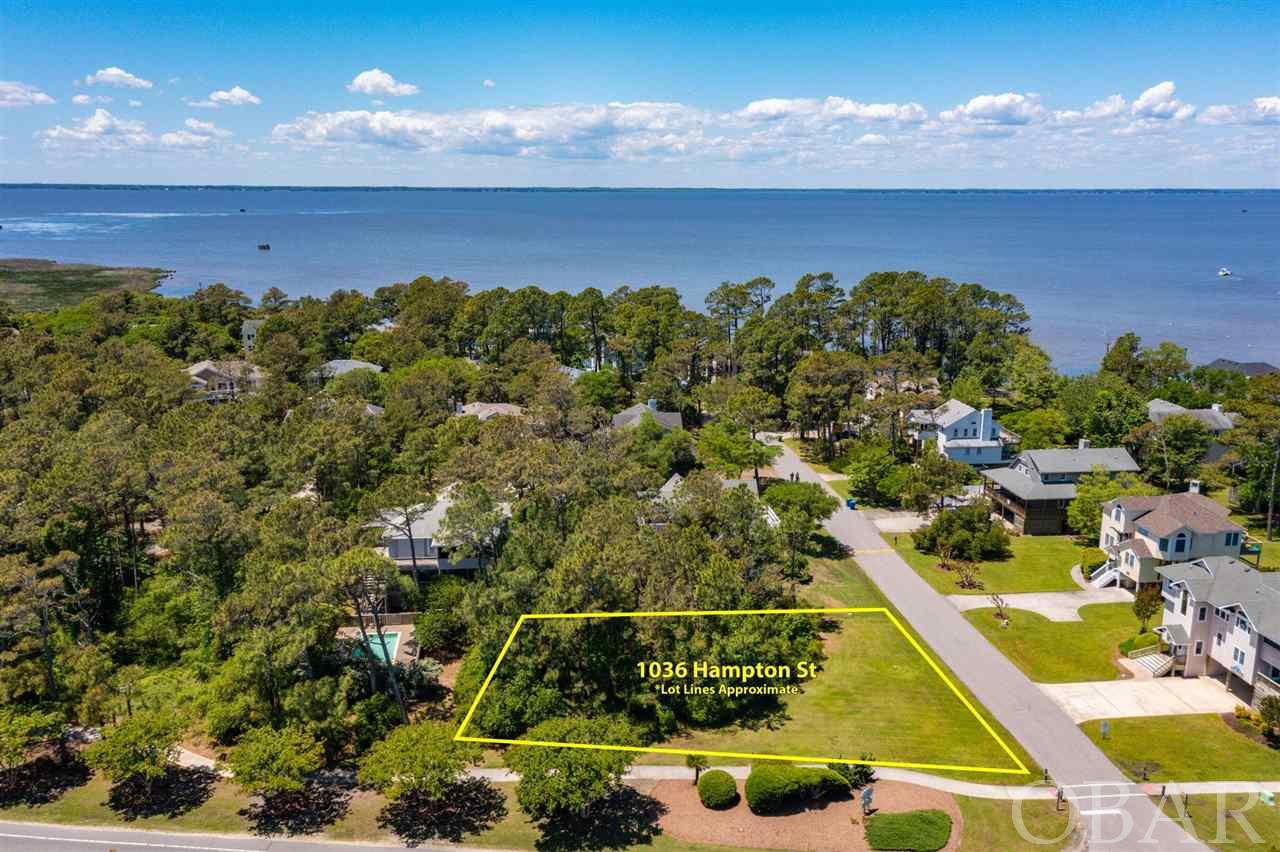 This parcel is one of the last buildable homesites in Corolla Light. It is a prime corner lot with room for up to a 6 bedroom home with pool. The homesite is level and dry in a X- flood zone.  Why buy an older beach house that needs updating and repairs?  Construct your dream home here and enjoy the benefits of a state-of-the-art house located in this most sought-after neighborhood.  Hampton Street's proximity to the sound offers peaceful strolls on the water's edge and spectacular sunsets nightly.   Walk to the beach or take the community’s trolley to the oceanfront complex where there are two huge pools, playground and oceanfront restaurant. The indoor Sports Center is nearby with an olympic-sized pool, fitness rooms, and clay tennis courts. Everything is close at hand:  shopping, dining, recreational facilities, Corolla Historic Park and more. There are very few unbuilt lots in Corolla Light and rarely does one come on the market. Seller is a local building contractor who would entertain an agreement with buyer to construct a new home on the site. Claim this lot now and construct a brand-new home with the features you want.  Or just hold on to this precious homesite and watch your investment grow. A recent survey is available.