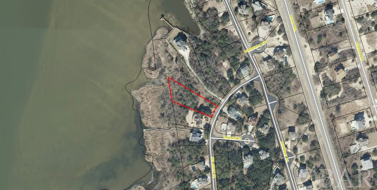 Incredible opportunity to build your waterfront dream home on The Northern Outer Banks of North Carolina. Pull your boat up to your dock behind your home to be built!