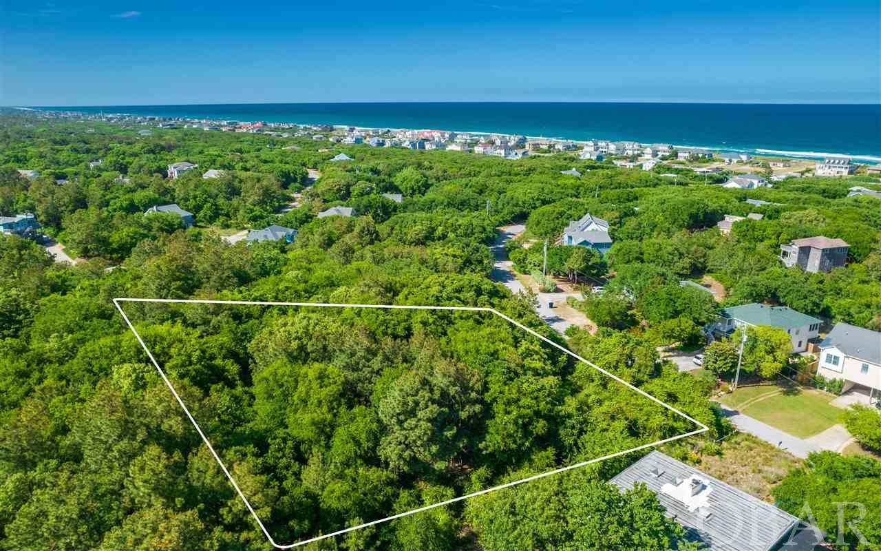 Acreage in one of the most desirable historical areas of Southern Shores. Incredible opportunity to own a huge parcel on popular Skyline Road.  According to Dare County GIS, this parcel is around 1.83+/- acres and has 240 ft. of road frontage. It is elevated in an X flood zone and just a short walk to the beach.  Beautiful park like setting with gorgeous old Live Oak trees and adjacent to  Chicahauk common property. This property is in the process of being surveyed to determine exact lot lines and dimensions.   Lot is subject to the proposed Town of Southern Shores beach nourishment tax increase of $0.0342 for a total tax of $0.34 per $100 of property value.