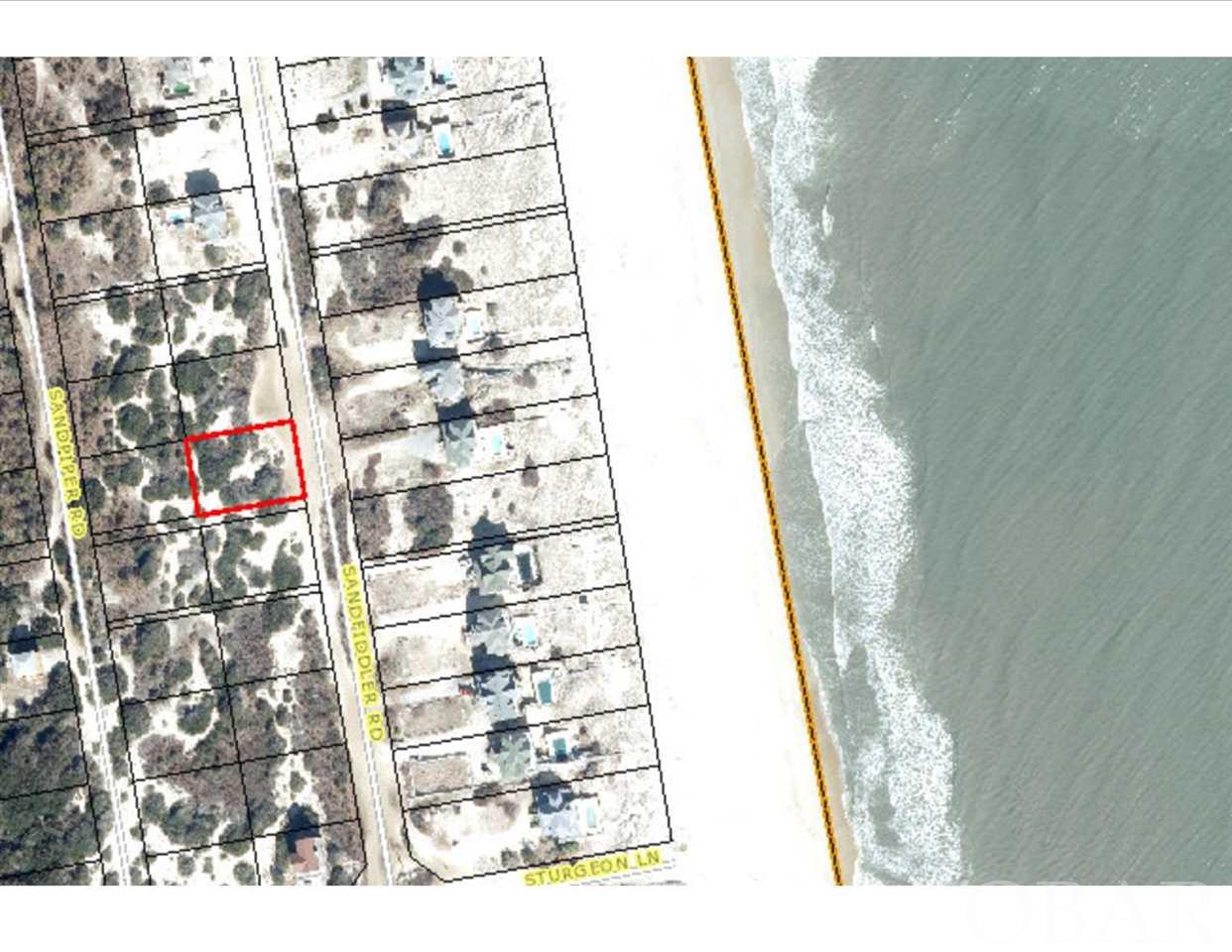Come get away from it all and have beautiful wild horses as your neighbors. This gorgeous semi-oceanfront homesite is 1 lot away from a platted pedestrian easement to the beach. Located in an X flood zone, so no flood insurance is required. There are many beautiful live oak trees on this homesite. The excellent elevation will provide gorgeous ocean views for any home built here.