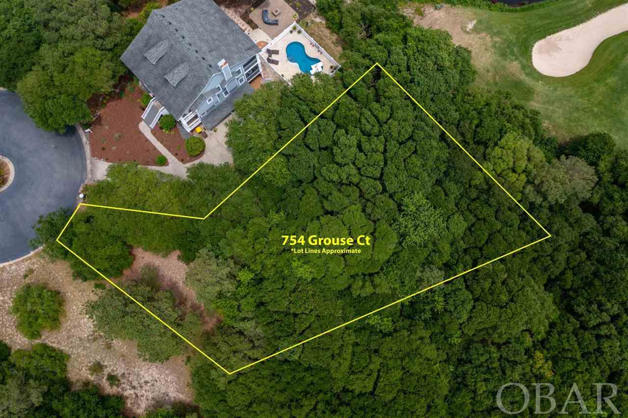 Gorgeous homesite located in the prestigious Currituck Club. 754 Grouse Ct offers premiere location and privacy. Off of the main drive of Hunt Club and sweetly tucked at the end of a quaint cul-de-sac. Beautiful views and vantage points are sure to be realized from a reverse floor homeplan. This luxury homesite checks all the boxes: outstanding community amenities, gated community, private location and great elevation.