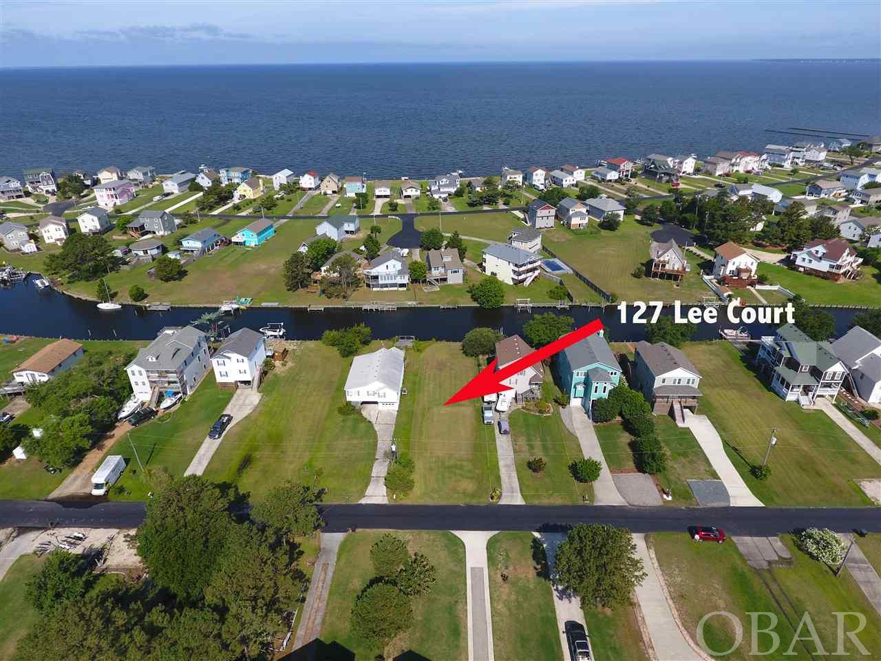 Deep Water Canal Front lot with newer bulk head. Located in the gated community of Colington Harbour.  Colington has a marina, outdoor community pool, clubhouse, tennis, sound side park and beach.  Owner had site evaluation done several years ago and had site work done and fill brought in but decided not to build.  Lot should need minimal prep to built on.