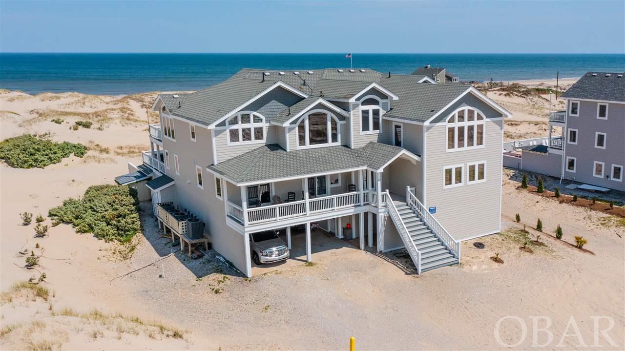 Large oceanfront home with beautiful ocean views! With over $220k in 2021 so far (does NOT include owner in-season time), you will not want to miss this amazing investment opportunity. This 12 bedroom, 12.5 bathroom home checks off all of the amenities needed for a successful rental property. The spacious floorplan allows the home to never feel 'crowded'. It includes a game room equipped with a pool table, ping pong table, foosball, AND air hockey with a kitchenette, as well as a full theatre room, perfect for rainy days! All of the bedrooms are spacious in size and include their own private bathrooms. The home offers a private inground pool with a brand new pool heater.  The top floor offers a spacious, fully stocked kitchen, with 3 dishwashers, 2 refrigerators, 3 overs, two range tops, and a icemaker, which can easily accommodate the large groups staying at the home. The living space has ample amount of seating, with ocean view windows, fireplace, and a large flatscreen television. The exterior holds plenty of deck space! * RECENT UPDATES INCLUDE * 2021 New siding and trim, and a new pool heater 2020.