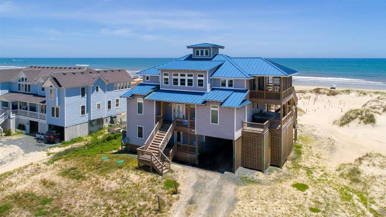 Top Shelf oceanfront oasis in North Swan Beach.  With SPECTACULAR ocean views from every level, this 6br/5.5 ba home was constructed in 2018!!  Quality can be found at every turn starting outside with the standing seam metal roof, Certainteed perfection vinyl siding, copper deck flashing, 2x6 decking, and PVC trim.  Inside you'll find an ELEVATOR servicing all 3 levels of the home.  On level one there is a spacious gameroom with luxury vinal plank flooring, pool table and wetbar, two bedrooms, full bath, laundry facilities as well as access to the large inground pool area.  On the midlevel you'll be treated to sweeping ocean views from the central sitting area, two ocean view master bedrooms and one west side master bedroom.  This floor also has a media room for night time entertainment.  On the top level you will immediately be awestruck by the ocean and beach views through the wall of glass in the greatroom, complete with chefs kitchen of 2 refrigerators & dishwashers, granite countertops, engineered oak flooring, Homecrest soft close cabinetry, and seperate coffee/cocktail wetbar station.  Also in the great room is a dining table for 12 and a spacious living room area with ocean views, flatscreen TV and fireplace.  Step out onto the generous screened porch to listen to the crashing waves and feel the cool ocean breeze.  Rounding out the top floor is the grand master suite with ocean facing bedroom and tiled shower looking out to the Atlantic.  This grand home is frequently used by the owners AND is also a productive rental home.  You cannot beat this location!