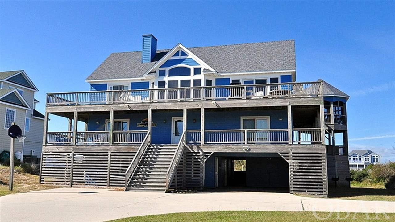 Semi-Oceanfront in Whalehead with Ocean Views located one lot away from the Coral Street Beach Access.  Elegantly designed from top to bottom with mostly new furniture throughout.  This 6 bedroom house is set up as a reverse floorplan with the great room, dining room and master bedroom on the third level.  There are three bedrooms and a den on the 2nd level and another two bedrooms and a rec room on the ground level.    Sitting on a 20,000 sq/ft high and dry lot, this house comes equipped with an elevator, large salt water pool and hot tub along with a gazebo.  Over the past two years, the sellers have remodeled the kitchen, refinished the hardwood floors, put new carpet throughout and replaced the roof.  Great rental history even with the owners taking some prime weeks and donating others.