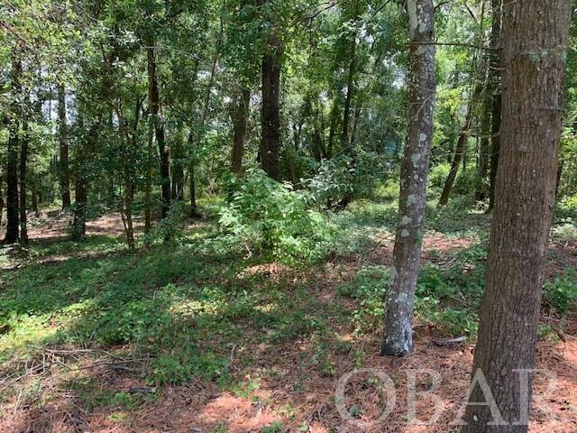 Great location to build your dream home nestled on a nice wooded lot with plenty of privacy in the quiet neighborhood of Sunrise Crossing!  An outdoors enthusiast's joy to have access to kayaking, you are within walking distance to the community boardwalk and dock for sound access. Community adheres to strict architectural guidelines for copacetic features to be offered.  This lot should be large enough to support a pool.
