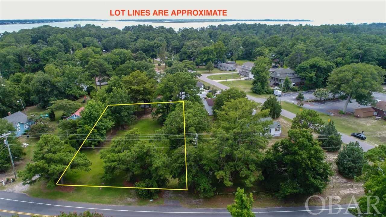 Large Kitty Hawk Village lot!  Approximately 22,500 square feet.  Cleared and ready to build.  Close to the beach and just minutes away from Kitty Hawk Bay for boating and fishing!  This is a little slice of the Outer Banks the way it used to be.  Kitty Hawk village is close to everything you want to do on the Outer Banks but tucked away just far enough.  Sandy Run Nature Park is just down the road with picnic tables, lake, wildlife and fun for the family.  Also nearby is the KH Nature Conservancy as well as the Kitty Hawk Park skateboard and play ground for your enjoyment.  There is public boat ramp on Bob Perry Road that provides easy access to Kitty Hawk Bay and the Albemarle Sound.  Public Beach Accesses are close by.  This is a great opportunity to own and build in Kitty Hawk!