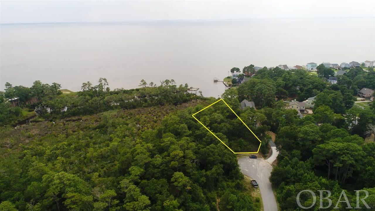 Private, wooded homesite sitting high on a ridge in an exclusive sound side community with high elevations, a sandy beach and unobstructed views of the Albemarle Sound.  Over 45 percent of the community will be left as a nature preserve, permanently conveyed.