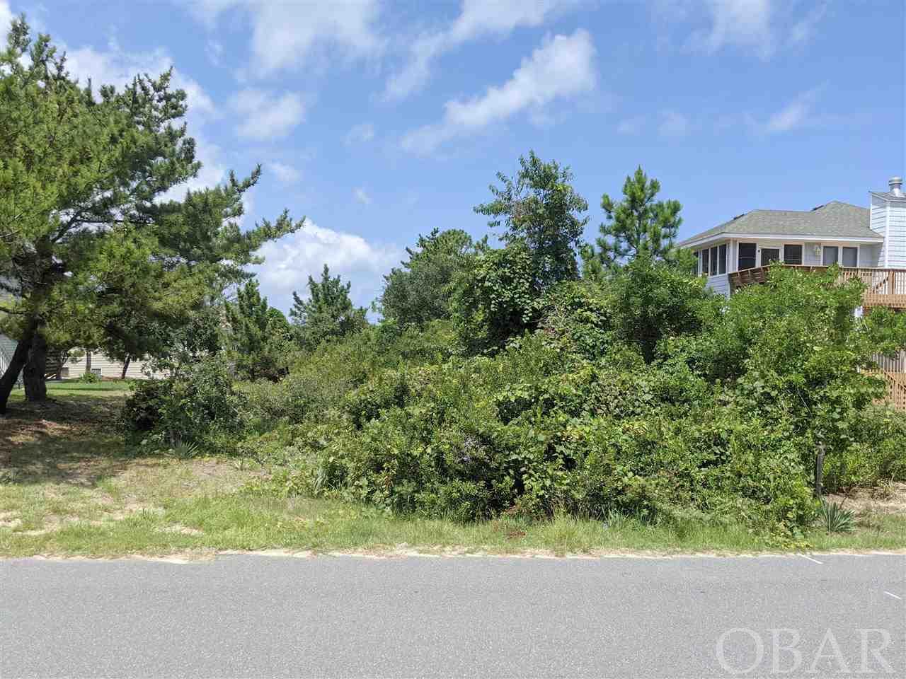 This beautiful high elevation lot in north Kill Devil Hills on the westside has Ocean and Sound views for your beach dream house. It is in an X Flood Zone. This is a quiet westside area close the the Walking and Bike Trail on Bay Drive. There are 3 Sound Accesses with in a short walk of this lot.