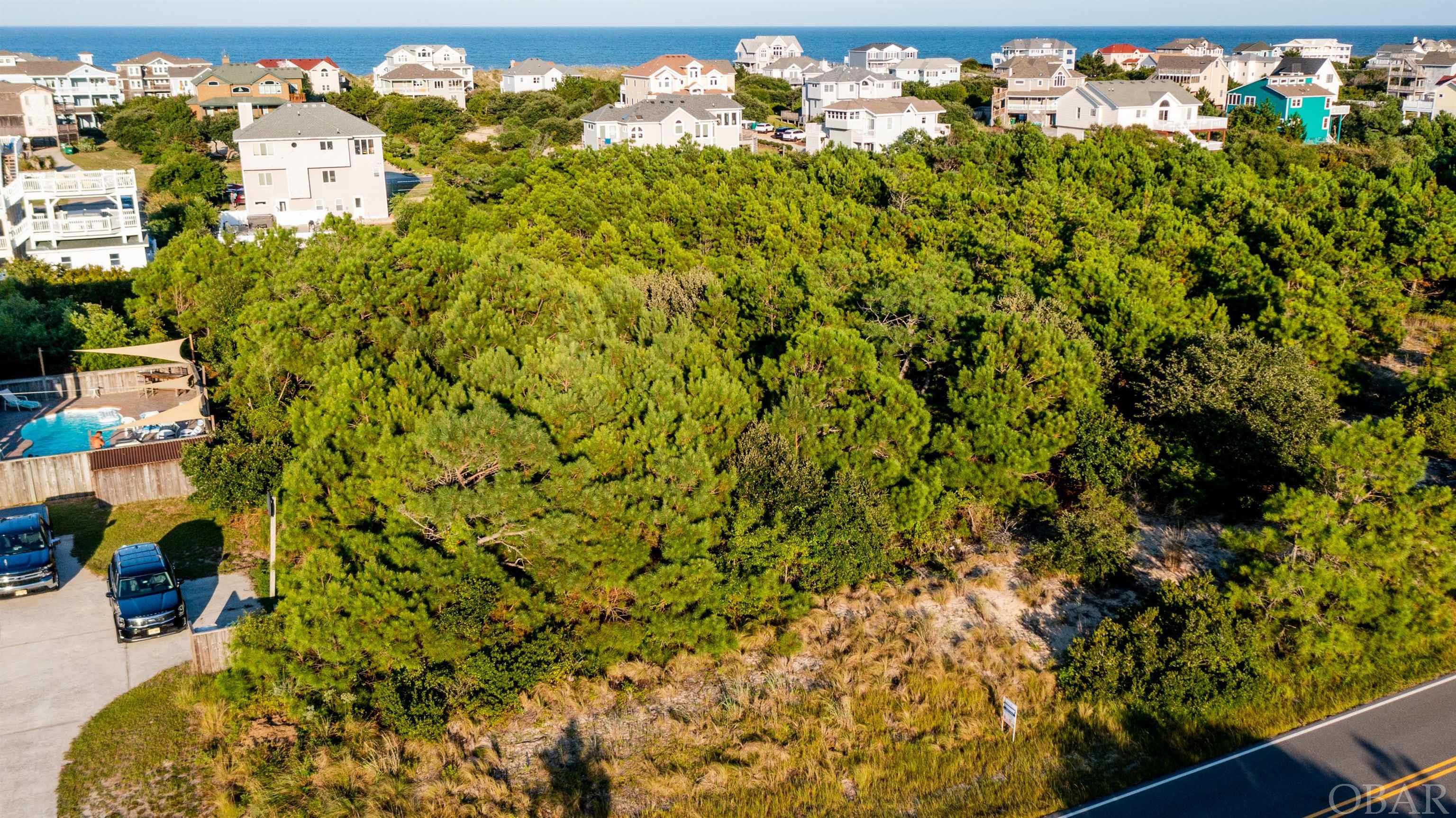 5th row lot in Whalehead, should have good ocean views, located in the quieter north end of Whalehead, Large homesite will accommodate a large rental machine type home, easy beach access.
