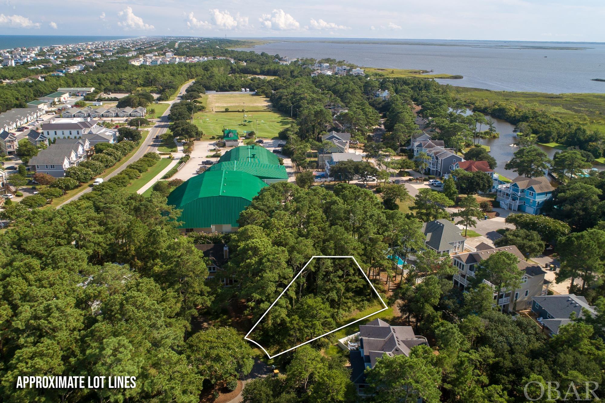 Excellent opportunity to build your dream home on this awesome lot in the award winning Corolla Light Resort! Located on a cul-de-sac close to the Indoor Sports Facility, this is a great lot for you to build the home you always wanted. Room for a pool!. X Flood Zone! Breeze over to the Corolla Light Sound side pool, walk the nature trails and enjoy the peaceful Currituck Sound. Corolla Light's amenities are 2nd to none, with 3 Oceanfront pools, Sound Side pool, 2 indoor and 8 outdoor tennis courts, Sports Center with competition size pool, exercise equipment, racquetball court and more!  A short walk to the Corolla Light Shops including restaurants and miniature golf course.