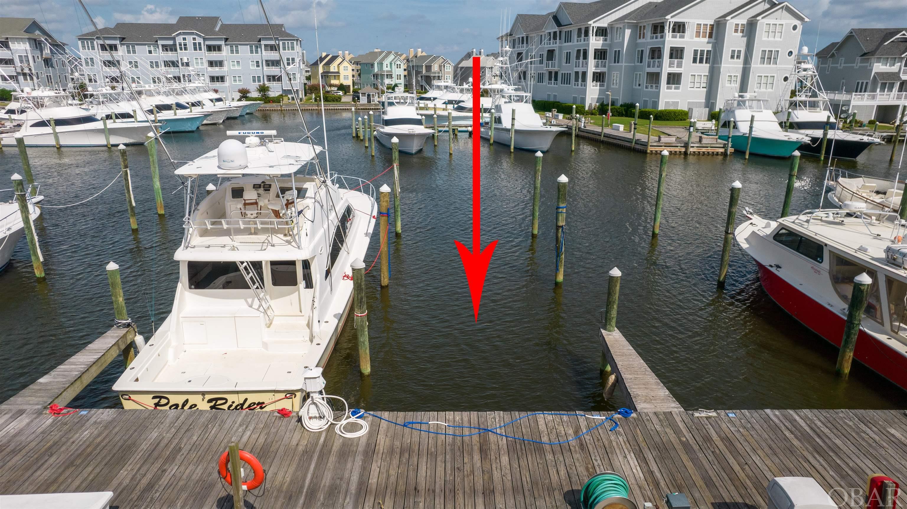 Located on G Dock, this 60FT x 20W boat slip has location value with easy sound access and parking.  Pirate's Cove Marina is a protected, deep water, full service marina with 195 slips and a charter fleet of sport fish boats for offshore, nearshore and inlet fishing.  Pirate's Cove Marina is one of the largest world class marinas on the East Coast with a high level of experienced charter sport fishing captains and crew. Pirate's Cove Marina offers: a fuel dock for non-ethanol gas and diesel, slips with in-slip fueling, private fish cleaning houses, showers, Ship's Store for light provisioning, an on-site full-service restaurant and Tiki Bar, and annual fishing tournaments.  Pirate's Cove Marina is approximately eight miles inside and north of Oregon Inlet via a deepwater, well-marked channel. The fixed bridge clearance of the Manteo/Nags Head causeway is 65 feet at mean high tide.