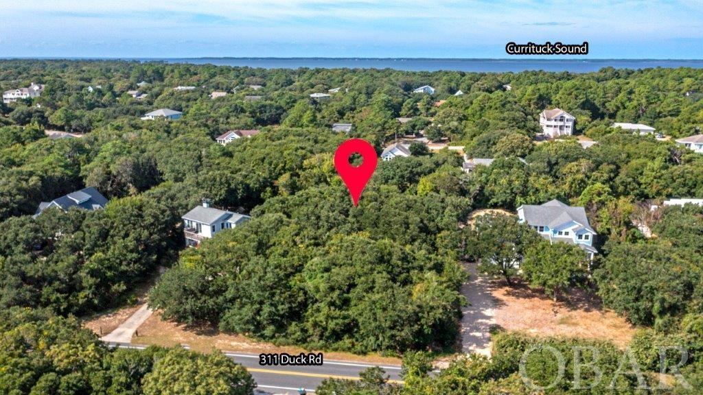 Fabulous Lot located at 311 Duck Road in much sought after Southern Shores *** Lot is just a 5 minute drive north to Downtown Duck Village! *** High Ground - "X" Flood Zone! *** Great Location to Build your Dream Home! *** When seeing this Lot be sure to take a short walk … or quick 2 minute drive ... to the Hillcrest Beach Access (approx. 75 parking spaces) ... The Hillcrest Beach Access Features Lifeguard in Summer, facilities in summer, newer Trellis Showers, Volleyball Court, Gazebo deck, Dune deck * Check out the Marina Boat Ramp provides access to Currituck Sound, the multiple Boat Marinas, 2 Soundfront Parks, revitalized dune Play Park w/ Basketball Court * Outdoor Community Tennis across the street (tennis and boat slips additional) * Not required to have a boat club membership to access the boat ramp * The optional Southern Shores Civic Association annual cost is approximately $60yr so everyone joins * Sidewalk through entire Town along Duck Road – great for biking, walking, running * Don’t want to miss shopping in nearby Duck … check out the Duck Town Green annual outdoor concerts & the newer Soundfront Boardwalk *** Kitty Hawk to Nags Head shopping & restaurants nearby * Short drive to the Wright Memorial Bridge through the Southern Shores back roads * The Outer Banks is filled with exciting things to see and do including the Atlantic Ocean (beaches), Lighthouses, Wright Brothers Monument, The Lost Colony, Jockey’s Ridge and so much more! *** If you're not ready to build hold it until you are ... Or hold it as a long term investment *** Come see this fabulous land parcel ... "Location"!