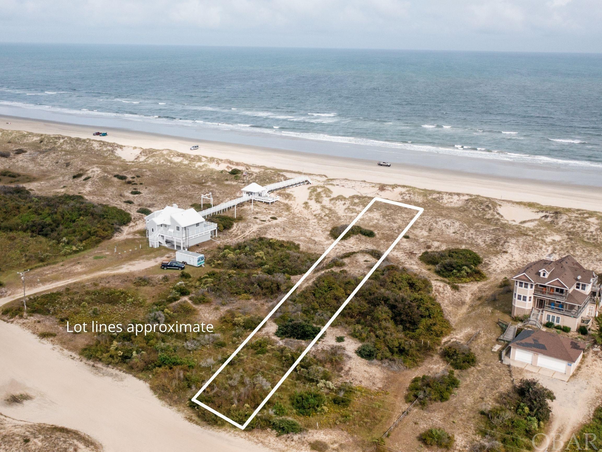 Build the vacation home of your dreams from this prime OCEANFRONT parcel! With 80 feet of ocean frontage, this spacious lot offers an established dune line and will boast expansive views of the ocean & beach from a home built in the future. Enjoy all the beauty that Carova Beach has to offer from the roaming wild horses to wide & white sandy beaches. This parcel is conveniently located less than 1 mile to the fire station, Carova Beach Park, and the Historic Coast Guard Station now serving as Twiddy's Sales office.