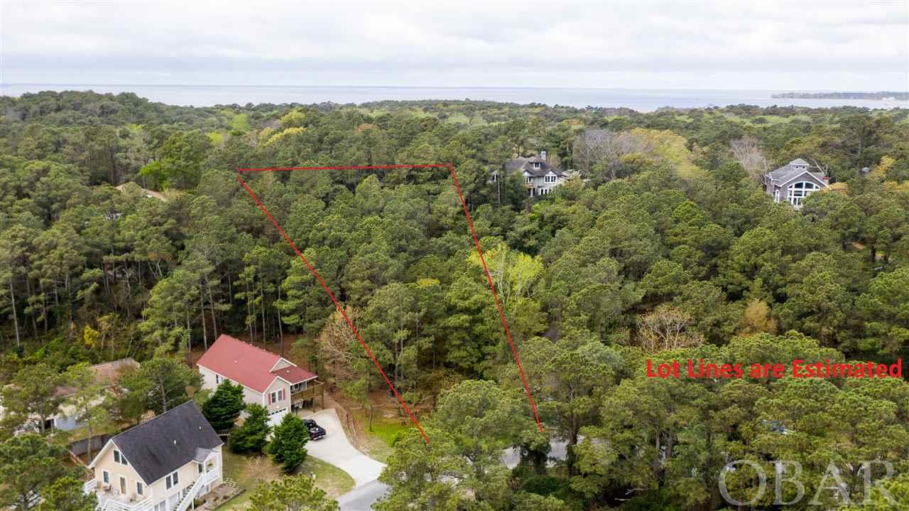 Large one acre lot with privacy in maritime forest!  Its rare to find properties of this size on the Outer Banks.   The lot itself has very tall elevations.  Potential ocean views from the top level of your home.  The neighboring house overlooks all houses and has views of the ocean directly to the east. Possible western sounds views too.   Great opportunity to build a private estate on the Outer Banks!  Survey from 2019 available!