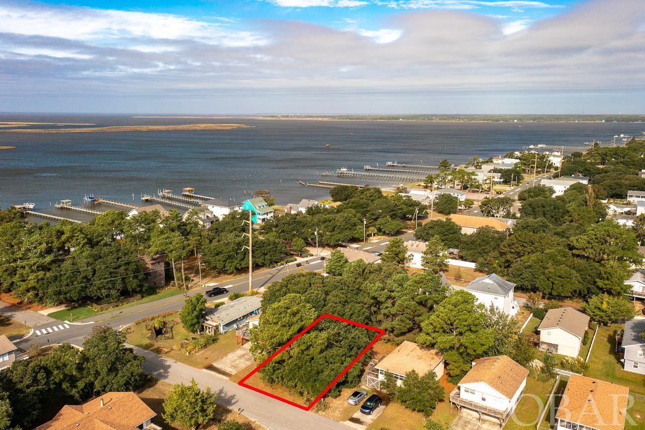 Amazing opportunity to grab your slice of the Outer Banks! Vacant land is RARE and this is a EXCELLENT location. Just 4 rows back from Kitty Hawk Bay and the coveted Bay Dr. area! It's just a hop, skip and a jump away from the multi use bike/walking path along the waterside and the public boat ramp. Approx. 5 to 10 minutes drive to multiple public beach accesses, Avalon Pier, restaurants, shops and grocery.  Kill Devil Hills is a wonderful community with endless offerings for those seeking that Outer Banks lifestyle. Buy and hold for your future beach house or build now and you'll be ready to hit the beach next summer!
