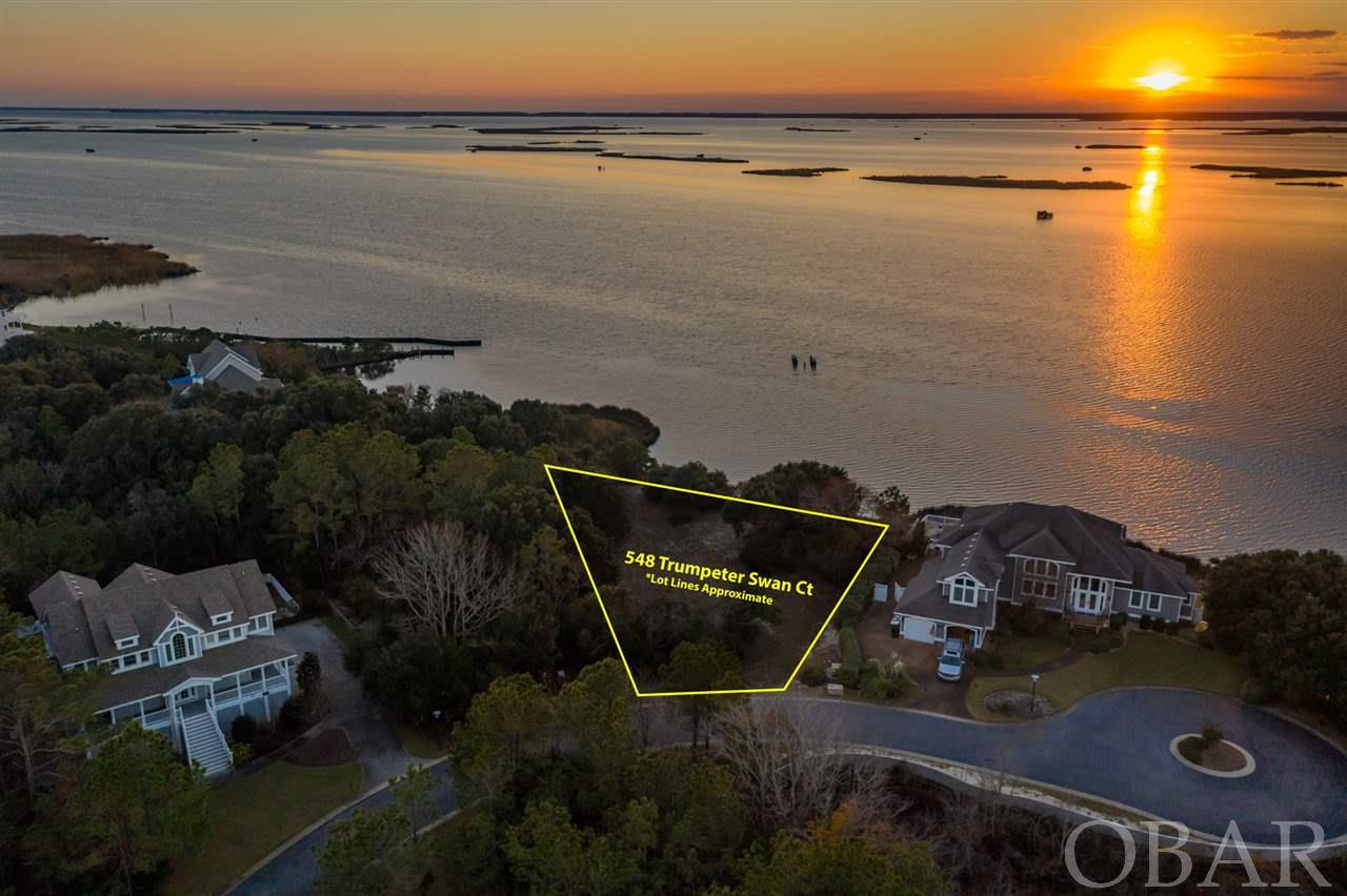 AMAZING OPPORTUNITY to own one of the very few homesites on the Currituck Sound that has 180 degrees of unobstructed views. Enchanting, fiery sunsets and magical, up-close encounters with native fowl - swans, geese, ducks, herons, ospreys, even the occasional bald eagle, will forever be yours. Nestled near the end of a quiet and peaceful cul-de-sac in the premiere Currituck Club community, this generous lot is unmatched in today's market. It needs only your vision of the perfect dream home to bring it to life. And the community amenities are unmatched, too - a health and fitness center, three community pools, ocean access, playground and courts for basketball, tennis, sand volleyball, shuffleboard, bocce and pickle-ball. For the golfing enthusiasts, the community is also host to a par-72 golf course designed by Rees Jones, complete with a renowned practice facility! The possibilities here are endless. Don't let this rare jewel pass you by. Survey on file, call for details!