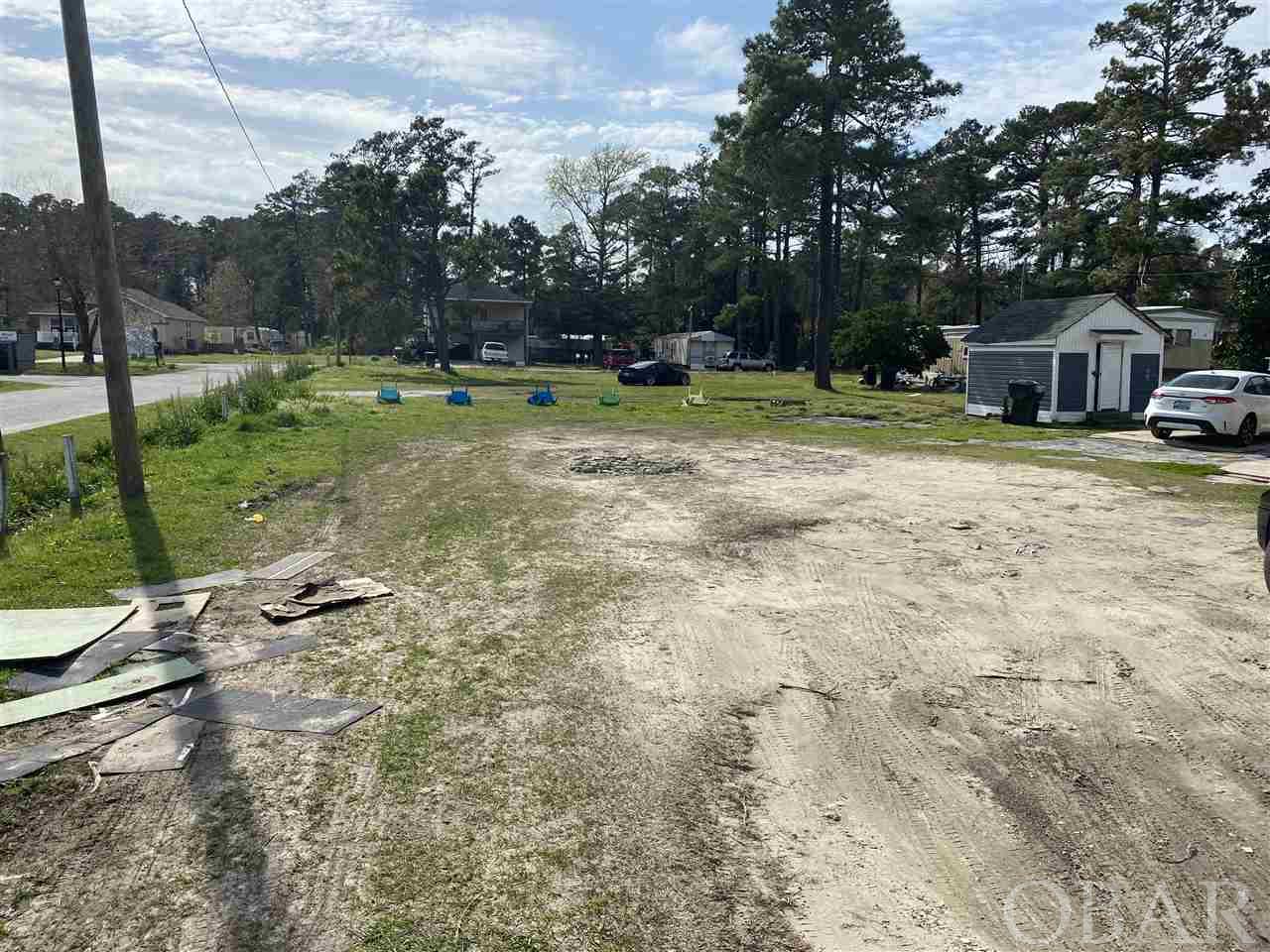 Large corner lot located on the highway 264 /64 within Manteo town limits.  Zoned commercial / res with high visibility for your business.Walking distance to Downtown Manteo, Restaurants, schools, shops, marina, etc.