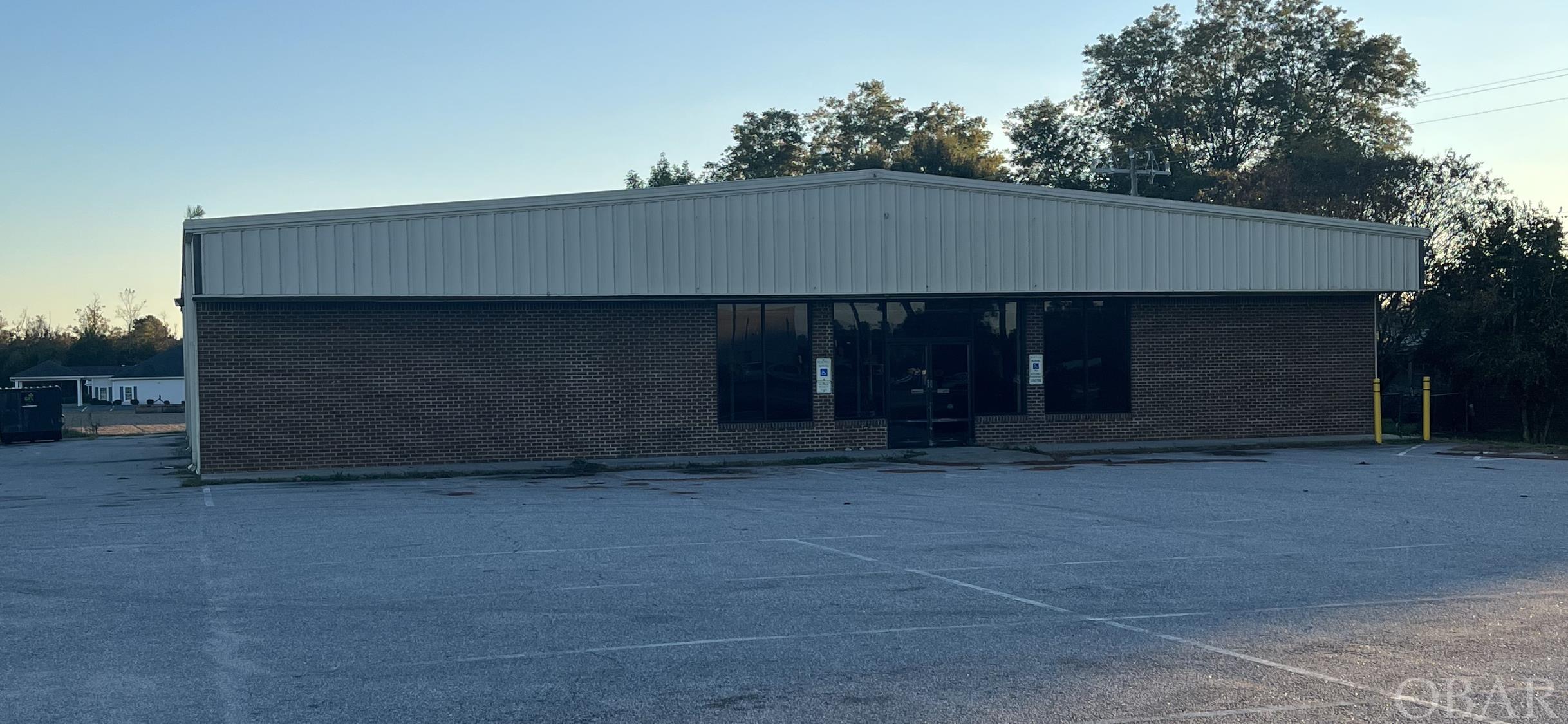 This commercial building was  originally a dollar store and has great potential.  7,208 square feet of retail showroom that could be a thrift store, church, grocery store, bingo hall, flea market, fitted for offices, warehouse, or a variety of other uses.  With 792 Square feet of storage the total footage is 8,000.  The asking price of $299,000 divided by 8,000 sq. ft. is only $37.37/sq. ft., well below today's construction costs.  The current tax value is $531,652. The asking price is 43.7% less than the tax value.