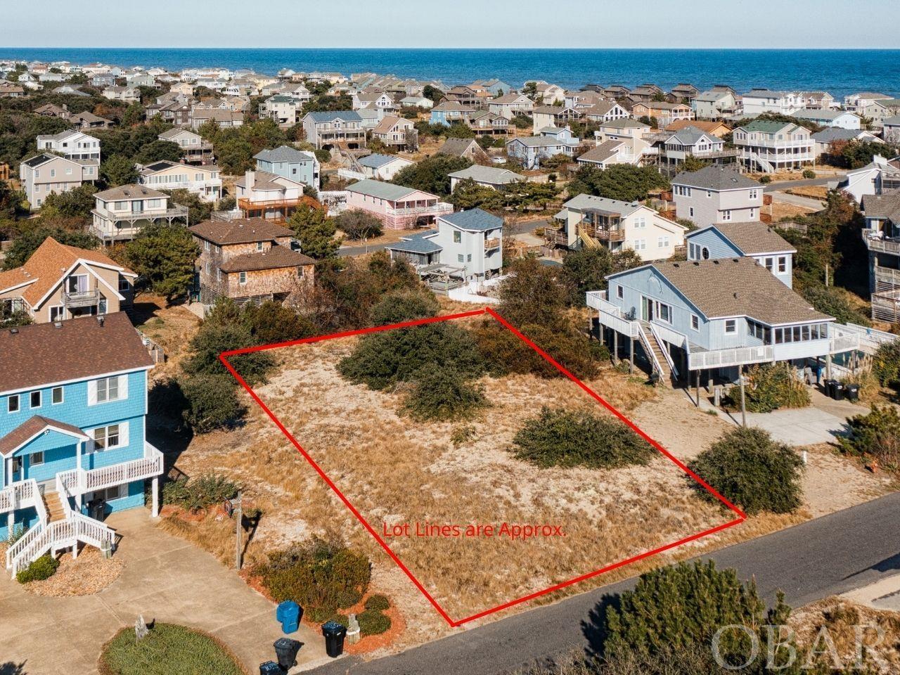 Build the beach home of your dreams on this charming street located in the sought after ocean to sound community of Duck, Carolina Dunes. This highly elevated parcel is the perfect location and size to accommodate a second home, investment property, or full-time residence. Offering direct beach and sound access, paved streets, and close proximity to water with the likelihood of views from a future home built. Enjoy the convenience of Ducks locally owned & operated shops and attractions just steps away.