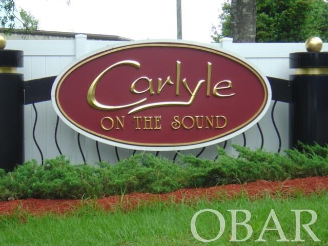 Great semi-soundfront lot. Carlyle on the Sound is a community focused on the beauty of its natural surroundings, for this reason 45% of the neighborhood is preserved for natural open space! Nice sized lot offering uplands of 18,934 square feet and lot backs up to protected property for privacy. First Flight school district! Not far from sound, ocean, and all the Outer Banks attractions!
