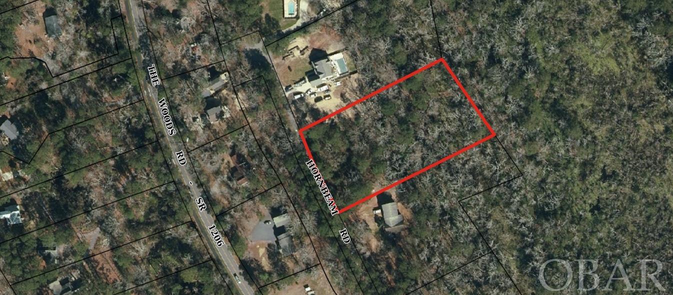 This 1.8+ acre hidden gem is a must see for anyone looking for a building site that is centrally located in Kitty Hawk yet prefers their privacy.  Located on a private street just off Woods road, this lot backs up to the protected Coastal Preserve land!!  There is ample high ground located in the x flood zone to build your dream home.  Walk down to the Woods Road playground or Sandy Run walking trail.  Explore the Coastal Preserve out your back yard.  You are right near Kitty Hawk elementary, and only minutes to the beach, groceries, restaurants, or the Wright Memorial Bridge.  This convenience and privacy is extraordinarily hard to find.  Some Seller financing considered. Recent survey and expired septic permit on file.