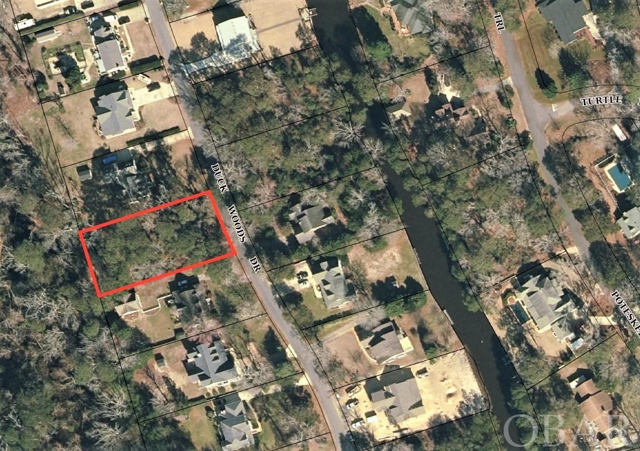 Build your dream home in the beautiful neighborhood on Duck Woods Dr, Southern Shores, NC.  Easy access to and from the mainland; just a mile to the bridge.  This quiet, family neighborhood offers a dead end street to guarantee very minimal traffic. Short distance to shops, beach, restaurants and Kitty Hawk Elementary School. Take advantage of the optional opportunity to join the Southern Shores Civic Association, dues are only $65 for residents and second home owners annually. A great value for your money!! Boat Club and Tennis Club memberships are only an additional $25 each. The SSCA owns and maintains the following properties, and your membership gives you access to them: • All 33 beach access walkways and dune crossovers in Southern Shores. • The Hillcrest Drive beach parking area. The site has 2 showers, toilets, a gazebo, benches and a viewing platform. Beach and viewing platform are wheelchair accessible. A volleyball court has been constructed at this site, as well. • Three marinas: North Marina, South Marina & Loblolly Marina. There is a boat launch ramp at the North Marina off South Dogwood Trail, as well as a pavilion for parties and events. We also offer wet and dry slips for SSCA boat owners, as well as kayak storage. (Boat Club membership required) • Soundview Park on North Dogwood Trail includes a children’s playground, picnic tables, charcoal grill, bocce ball court, horseshoe pit, park benches, a kayak launching platform and a relaxing sandy beach. • Sunset Platform on North Dogwood Trail includes a seating area overlooking a sandy beach, a great spot for sunset viewings! • Hillcrest Tennis Courts (at Hillcrest Drive near Sea Oats Trail). (Requires Tennis Club Membership) • Sea Oats Park (corner of Sea Oats and Hickory Trails). Sea Oats Park provides a basketball half court with one hoop, children’s play area, soccer field and picnic tables. • And many other SSCA natural open green spaces!